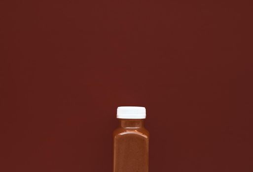 Detox superfood smoothie chocolate bottle for weight loss cleanse on.brown background, flatlay design for food and nutrition expert blog