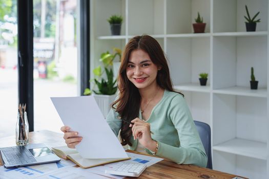 f girl, showing smiling faces while working on financial documents