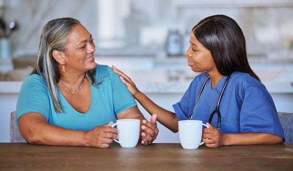 Black woman healthcare doctor with elderly patient talking for support, trust and help at nursing home. African medical volunteer, caregiver or girl care, conversation and communication with senior.