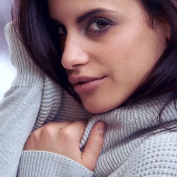 Warm, soft and sexy. Closeup of a beautiful brunette in winter clothing.