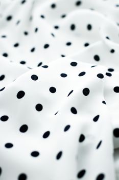 Classic polka dot textile background texture, black dots on white luxury fabric design pattern