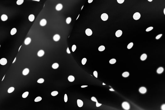Vintage polka dot textile background texture, white dots on black luxury fabric design pattern