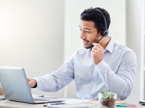 Asian call center man, telemarketing and CRM consultation with customer service, contact us and support in office. Consultant, businessman and employee working with consulting, help and IT support.