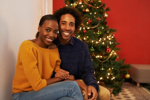 Its a time to be joyful. Portrait of an affectionate young couple on Christmas.