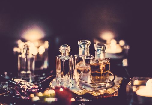 Perfume bottles and vintage fragrance at night, aroma scent, fragrant cosmetics and eau de toilette as luxury beauty brand, holiday fashion parfum design