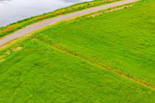 North German agricultural field forest river water dyke dike and nature landscape panorama in Weddewarden Bremerhaven Germany.