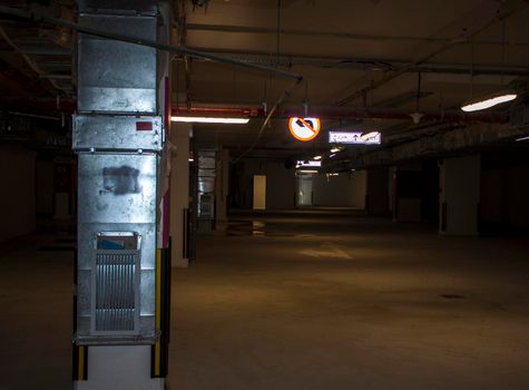 Underground parking in under construction building. Facilities