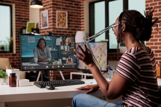 Employee chatting with remote team on video call