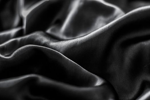 Luxury black soft silk flatlay background texture, holiday glamour abstract backdrop