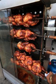 roast chicken in a street restaurant