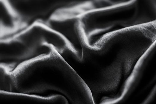 Luxury black soft silk flatlay background texture, holiday glamour abstract backdrop