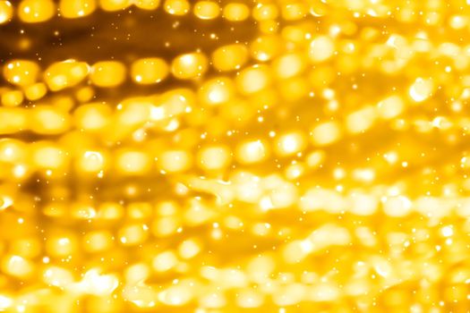 Glamorous gold shiny glow and glitter, luxury holiday background