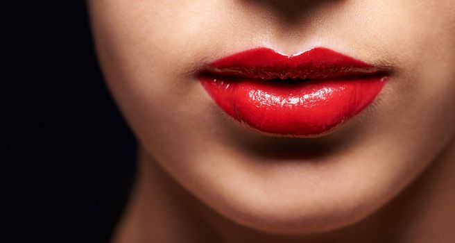 Every kiss has a colour. Cropped beauty portrait of a young womans lips.