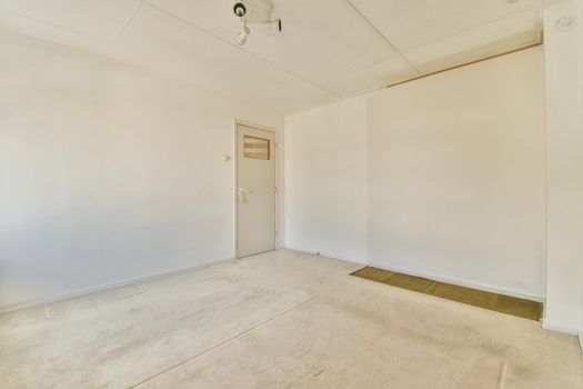 Empty room with panoramic window and radiator