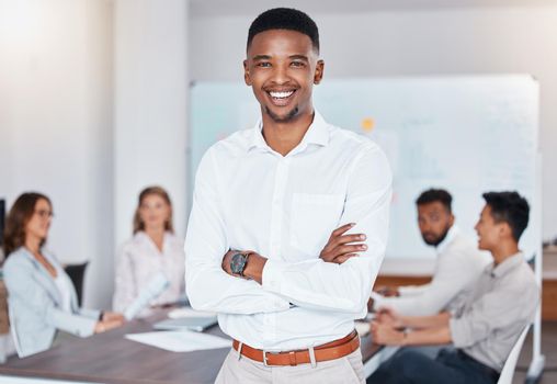African businessman smile, during meeting at work while staff talk at table in office or boardroom. Black man happy as corporate leader, workers have conversation or planning new strategy for company