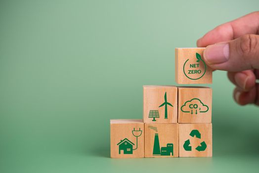 wood cube block icon net zero carbon credit and eco energy green technology on green background.