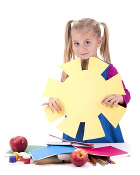 Creativity concept. hild and creativity. girl cuts the sun out of colored paper. isolated on white