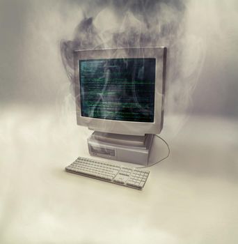 This computers time is up. a desktop computer smoking after burning out.