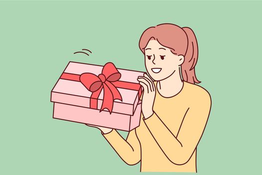Excited woman open birthday present
