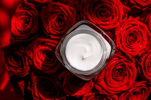 Moisturizing beauty face cream for sensitive skin and red roses flowers, luxury clean skincare cosmetics on floral background
