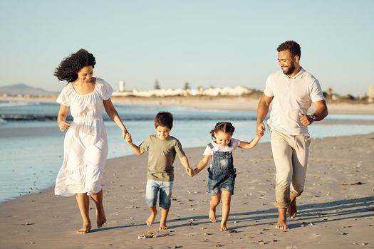 Happy family, beach and family bonding while walking and laughing at sunset, cheerful and relaxed. Fun parents sharing playful activity with their children, enjoying parenthood and walk along ocean