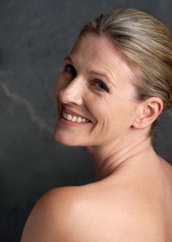 Beautiful inside and out. Cropped studio portrait of a beautiful mature woman with bare shoulders.