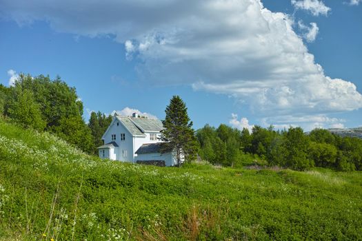 Quaint cottage in the nordic countryside. A quaint country house in the countryside in Norway.