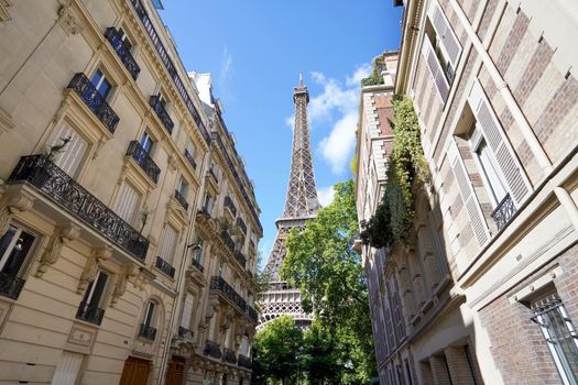 The Eiffel Tower view between palaces in Rue de l'Université street, 7th arrondissement, Paris, France