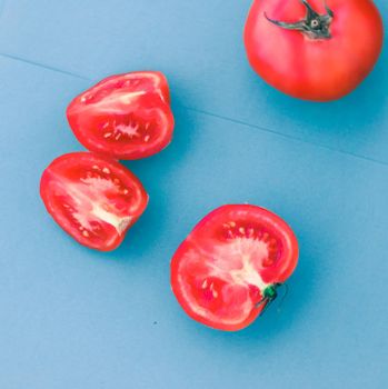 Fresh ripe red tomatoes on blue background, organic vegetable food