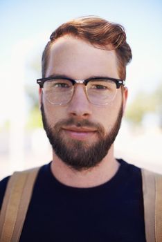 The epitome of geek meets hip Meet the modern hipster. A handsome young hipster outdoors while wearing glasses.