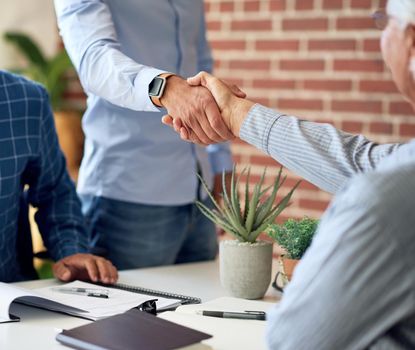 business people handshake in office meeting shaking hands after successful partnership deal for startup company
