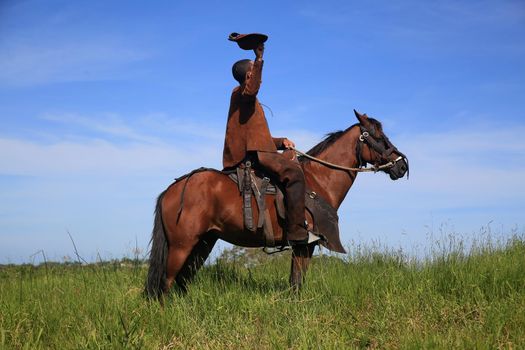 cowboy wearing traditional leather and horse costumes