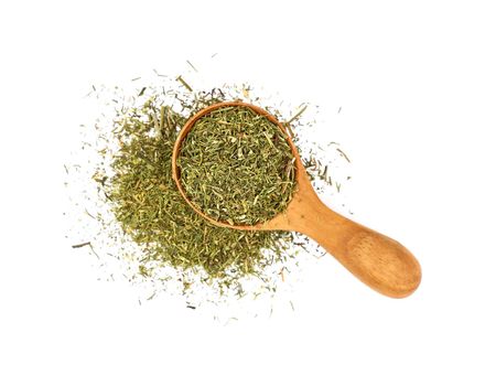 Wooden scoop spoon full of dried herbs spice