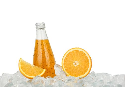 One glass bottle of orange drink on ice