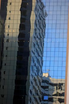 reflection in mirrored building