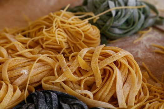 Cooking traditional Italian tagliatelle pasta