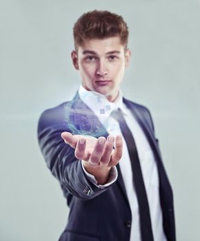 Welcome to the digital age. A businessman holding a glowing orb.