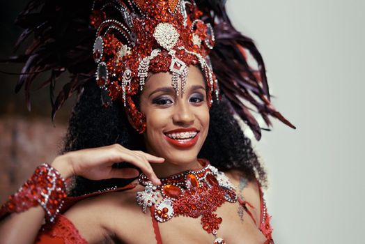 Live performances are her passion. Cropped portrait of a beautiful samba dancer wearing a headdress.