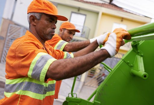 Keeping the city clean. a team of garbage collectors.