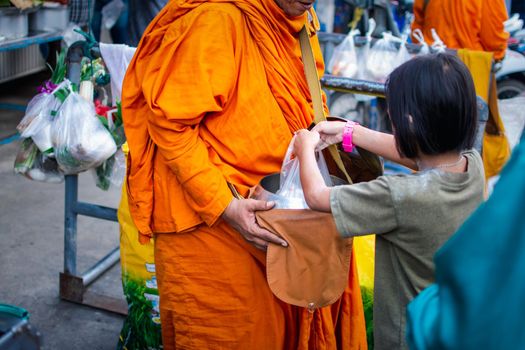 Thai monk ask for alms for buddhist to make merit