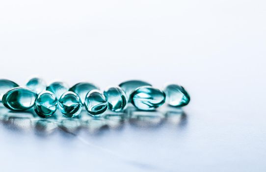 Blue pills for healthy diet nutrition, supplements pill and probiotics capsules, healthcare and medicine as pharmacy and scientific research background