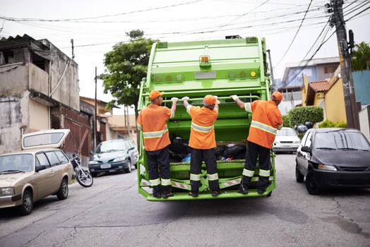 Garbage collection day. a garbage collection team at work.