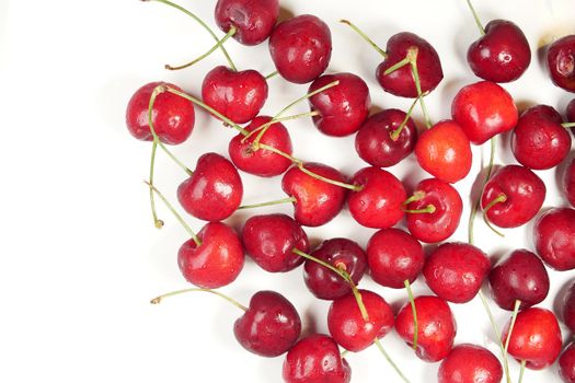 ripe fresh cherry on a white tray