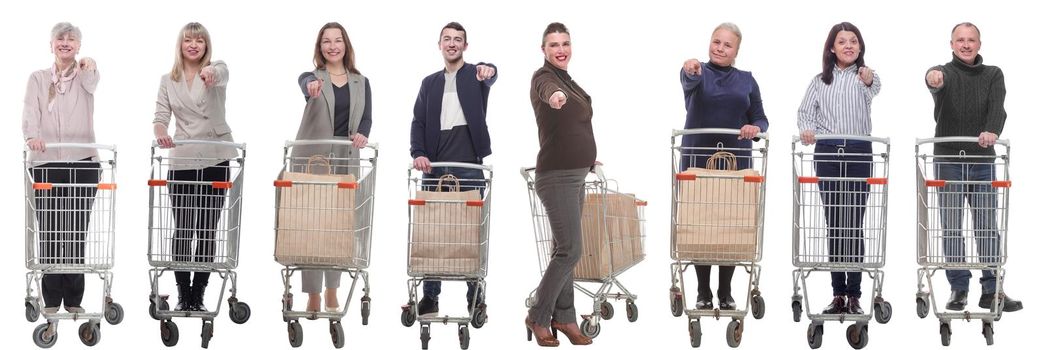 group of people with shopping cart showing thumbs up at camera