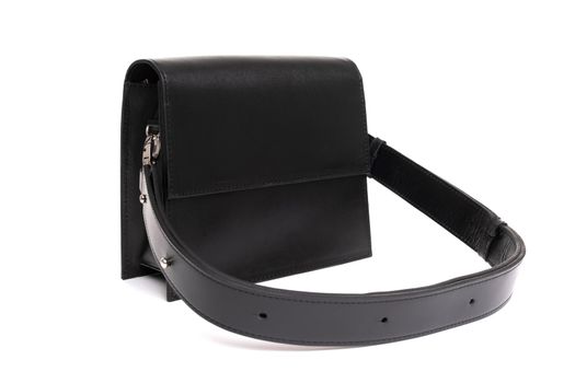 black rectangular women's leather bag with a belt