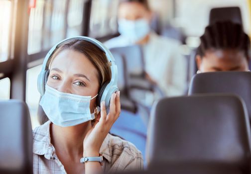 Covid, travel and music for woman on bus journey or transportation with mask for safety against covid 19 virus. Portrait of relax young girl with headphones streaming or listening to radio podcast.