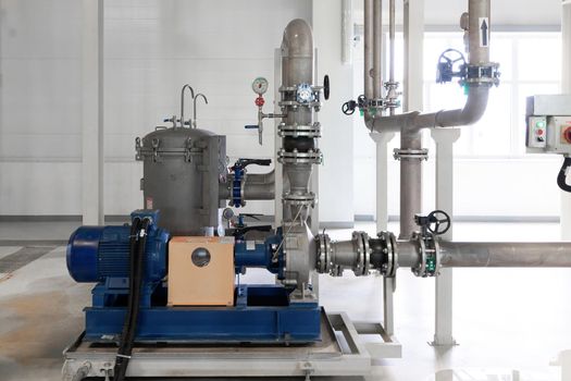 Closeup photo of pipes and tanks. Chemistry and medicine production. Pharmaceutical factory