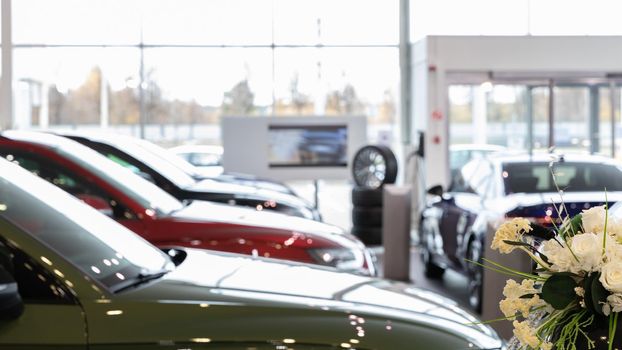 showroom of an official car dealership, photo with depth of field focus in the foreground