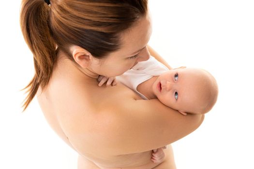 a newborn baby in the arms of a caring mother, tenderness and caring for a small child