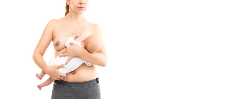 young woman breastfeeding baby on white background, half-length shot